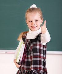 Schoolchild near blackboard.