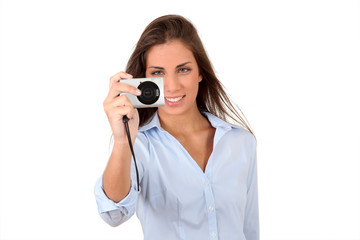 Portrait of beautiful woman using compact digital camera