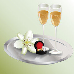 Champagne glasses, diamond ring and lily flower on the tray