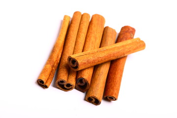 Pack of several cinnamon sticks isolated on white background