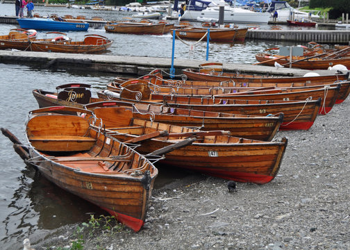 Boats for hire in the pretty lake side town of Bowness On Windermere in the beautiful English Lake District .