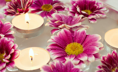 Fototapeta na wymiar Candles with flowers