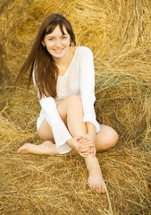 Sexy girl on hay