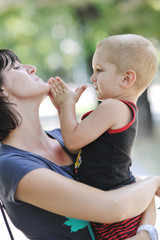happy children and mom have fun at park