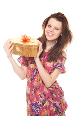 smiling young woman with gift gold box as heart