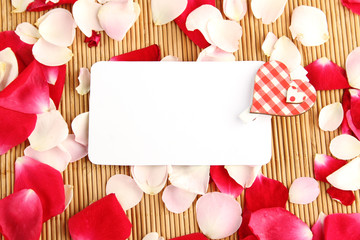 Card and rose petals