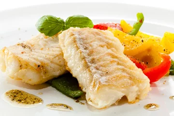 Foto auf Acrylglas Fertige gerichte Fish dish - fried fish fillets and vegetables