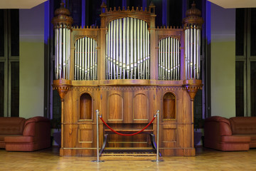 Massive wooden pipe organ with many metal pipes