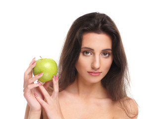 Portrait of a young brunette woman holding a fresh green apple