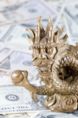 Gold dragon, symbol of 2012 year against dollars