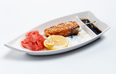 Shish kebab on a plate in the form of a boat