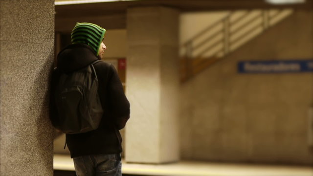 Man waits for the subway.