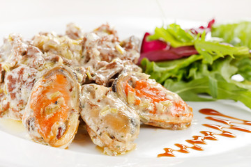Fricassee with seafood and salad