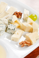 Cheese plate with grapes and honey