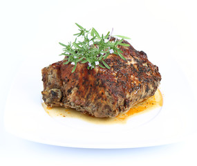 Roast pork decorated with savory blooming twigs