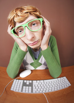 Sad nerdy guy at the computer
