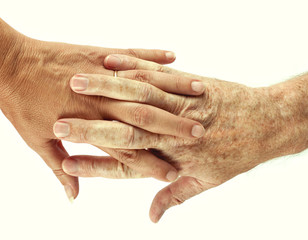 Couple interlinked hands over white background