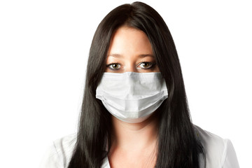 attractive female brunette nurse in mask isolated on white