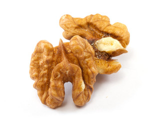 Crushed walnuts on white background