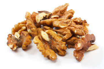 Crushed walnuts on white background