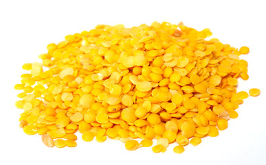 Yellow lentils isolated on white background.Macro shot