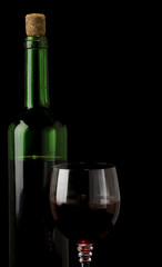 glass of red wine isolated on black