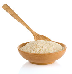 Fototapeta na wymiar rice in wooden plate and spoon
