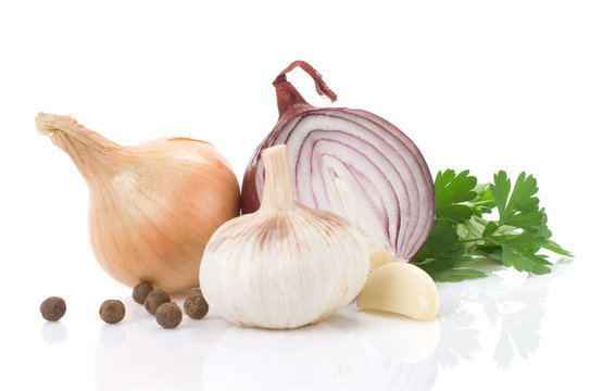 garlic, onion and green parsley isolated on white background