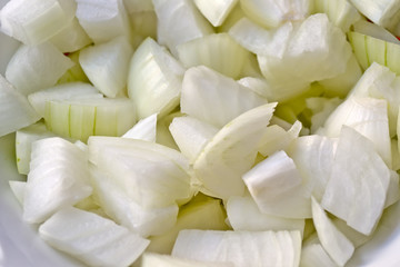 Pieces of white onions for cooking background