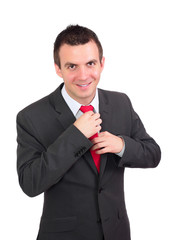 Portrait of cheerful businessman in black suite.