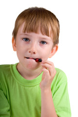 Boy eating berries