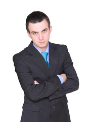 Caucasian businessman with crossed arms.