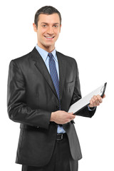 Smiling businessman holding a clipboard