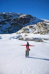 happy winter hiking woman on snow
