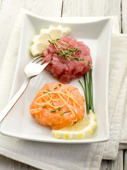 salmon and tuna tartare with lemon and chive