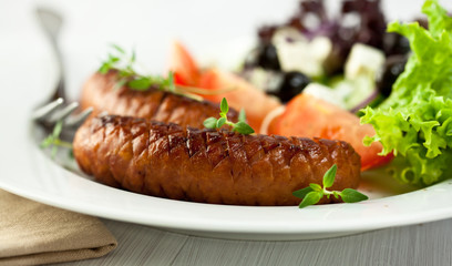 Grilled sausage with salad