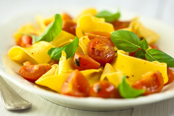 Pappardelle pasta with cherry tomato and basil