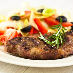 Grilled pork steak  with salad