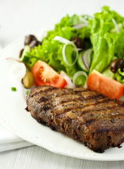 Grilled steak with vegetable salad
