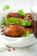 Roasted chicken legs with basil and pink peppercorns