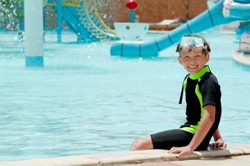 Happy boy in water park