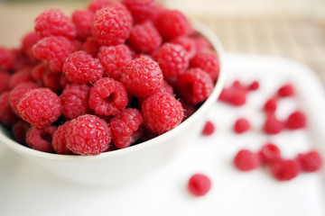 plate full of raspberries
