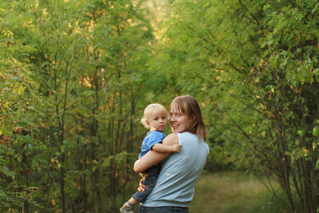Fototapeta premium Baby with mother walk in nature