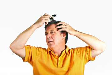 attractive man combing his hair