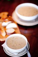 bowls of soup with bread