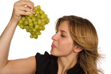 young woman holding green fruit over white background