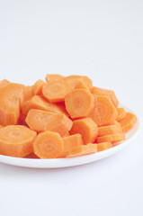 Fototapeta na wymiar Sliced carrots in a white plate