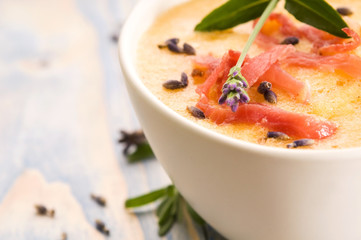 fresh melon soup with parma ham and lavender flower