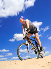 Fototapeta premium Young men riding a bike