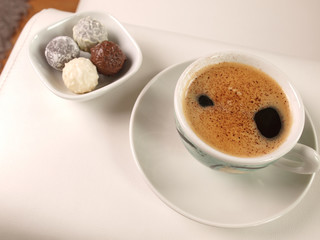 Cup of coffee with fine chocolate